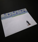 White envelope with a cartoon character on a black background