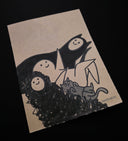 Illustration of a family of monsters and a cat on beige paper.