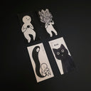 Set of 4 illustrations, black and white of simplistic characters being overtaken by a spirit and a final cat character.