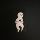 A minimalist black and white drawing featuring a simple cartoon figure, displayed against a dark background.