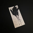 A drawing of a simplistic small character with large black plumes of smoke coming out of its eyes.