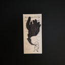 A drawing of a simplistic small character with large black plumes of smoke coming out of its chest.