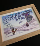 A framed artwork featuring a whimsical illustration of a small figure with a stringed instrument, floating paper coming off of it, a large gray statue, and a purple bird, displayed in a light wood frame against a black background.