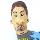 Ceramic sculpture of Beavis and Butthead, seen only from the shoulders up and fused together at the shoulder. 