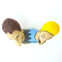 Ceramic sculpture of Beavis and Butthead, seen only from the shoulders up and fused together at the shoulder. 