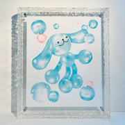 Risograph print in mostly blue with light orange color accents of a cartoon dog made out of bubbles, floating amongst other bubbles.