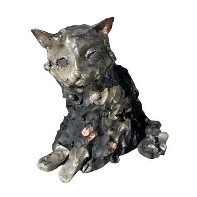 Ceramic sculpture of a melty looking cat.