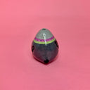 Small ceramic figure of a rounded, chubby gray bird with a vase opening atop its head.