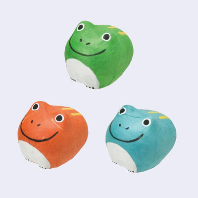 3 small paper mache frogs with simple smiles and stout bodies. Colors are: red, green and blue.