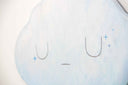 2 die cut wooden panels, one shapes like a cloud and painted light blue with a simple closed eye expression. Below, is a champagne pink colored lightning bolt.