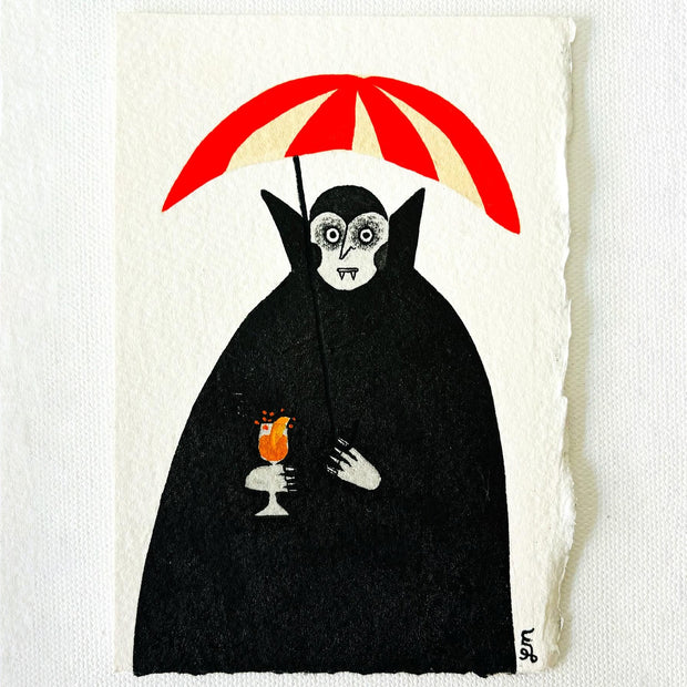 Ink illustration of a vampire with a very large black coat holding a red and white striped umbrella overhead. It holds a small glass of an orange carbonated drink.