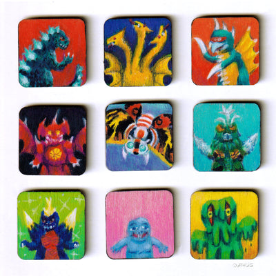 Set of 9 colorful monster-themed coasters on a white background
