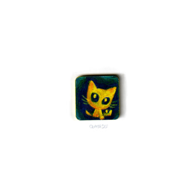 Very small square wooden panel with an illustration of a cartoon cat on a dark blue background.