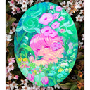 Painting on oval shaped wooden panel of a girl with pink hair and an apathetic expression sitting in very lush greenery, with blue, purple pink and white flowers in front of her and more greenery behind her.
