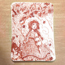 Illustration of a woman in a dress with floral and nature elements on a wooden surface