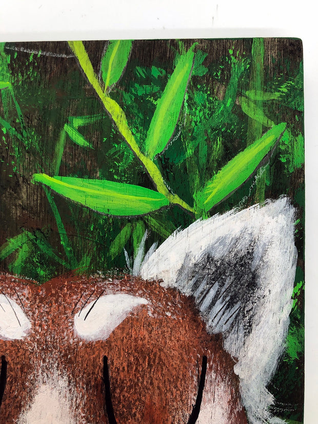 Illustrative style painting of a cute, red panda with large closed eyes and a smiling tongue out expression. Only its head is visible but it takes up most of the surface, with bamboo behind it.