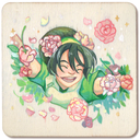 A square wooden thin panel featuring a colorful painted illustration of a smiling character with dark green hair, surrounded by pink flowers and green leaves on a cream background.