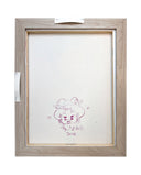 Back side of a framed canvas with a doodle by the artist.