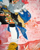 Framed painting of a cartoon character in traditional Japanese attire but modern sneakers, walking with a dog in her side pouch and looking at a map of San Francisco. 