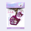 Die cut acrylic charm attached to gold ware keychain. Charm features an illustration of Kuromi sitting next to a purple jelly fruit dessert in a cup.