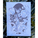 Floral design on a blue paper with greenery around
