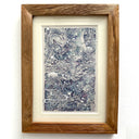 Finely detailed blue pen illustration of a girl's face, close up and seen at the side, surrounded by fish, water bubbles and sea kelp as if underwater. In a wooden frame.