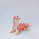 Ceramic figurine of a white and pink fox with 3 tails and patterned fur. It has red "wind" designs on it and gold painted accents.