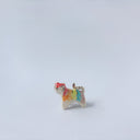 Very small ceramic sculpture of a tiger with a white underbelly and rainbow coloring on its back with gold detailing.