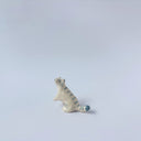 Very small glossy ceramic sculpture of a white tiger with blue stripes and subtle gold detailing.