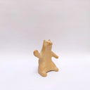 Brown clay ceramic figure of a wolf, sitting on its hind legs and waving.