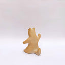 Brown clay ceramic figure of a wolf, sitting on its hind legs and waving.