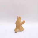 Brown clay ceramic figure of a wolf, sitting on its hind legs and waving.