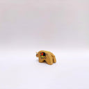 Small ceramic sculpture of a brown bison with 2 cream colored horns, red cheeks and a circular multicolor emblem on its side.