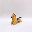 Ceramic sculpture of a brown horse with a black mane and tail, with a blanket on its back and poppy flower designs on the side of its body.