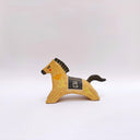 Ceramic sculpture of a brown horse with a black mane and tail, with a blanket on its back and poppy flower designs on the side of its body.