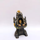Ceramic figurine of a black bear, with its arms cradling 2 small animals - a miniature deer and a miniature buffalo. The bear has 2 ravens on its shoulders and a gold coin atop its head.