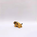 Small ceramic sculpture of a brown lion, with a flat, painted mane, and a multicolor emblem on the side of its body.