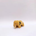 Small brown ceramic figurine of a prehistoric tusked elephant, with hands painting on its sides and a flower design on its back.