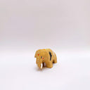 Small brown ceramic figurine of a prehistoric tusked elephant, with hands painting on its sides and a flower design on its back.