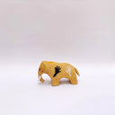 Small brown ceramic figurine of a prehistoric tusked elephant, with hands painting on its sides and a flower design on its back.