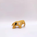 Small brown ceramic figurine of a prehistoric tusked elephant, with hands painting on its sides and a flower design on its back.