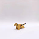 Small ceramic sculpture of a brown tiger, with black stripes on its back and tail and a circular 4-colored emblem on its side.