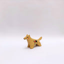 Small ceramic figurine of a brown wolf, with red cheeks and a circular 4-color emblem on its side.