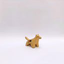 Small ceramic figurine of a brown wolf, with red cheeks and a circular 4-color emblem on its side.