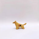 Small ceramic figurine of a brown wolf, with red cheeks and a circular 4-color emblem on its side.