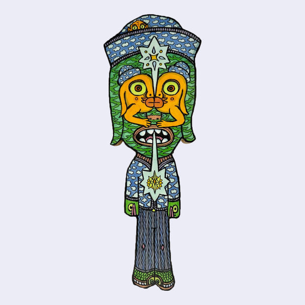 Illustration made with many lines, giving it the feel of a folk art woodcut on a die cut wood panel of a character dressed like a sailor, standing with their arms at their side. Their eyes are made out of 2 orange characters kissing one another.