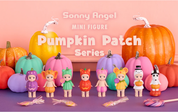 Sonny Angel mini figures in pumpkin-themed outfits with colorful pumpkins on a pink background