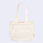 Cream colored tote bag with 8 clear slots in the front for small figures (such as Sonny Angel mini figures) to be placed. Pink embroidered "Sonny Angel" is written along the top.