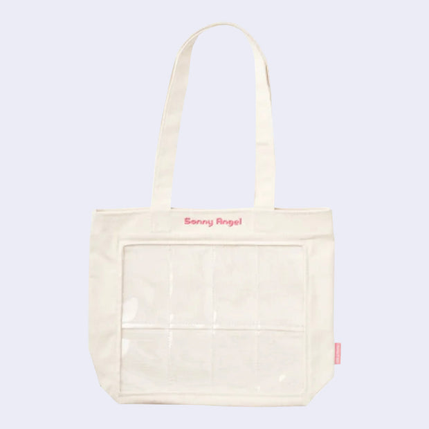 Cream colored tote bag with 8 clear slots in the front for small figures (such as Sonny Angel mini figures) to be placed. Pink embroidered "Sonny Angel" is written along the top.