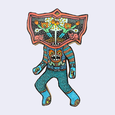 Illustration made with many lines, giving it the feel of a folk art woodcut on a die cut wood panel of a character with knit sweater and pants and a head shaped like a bat - with 2 flying characters within it.